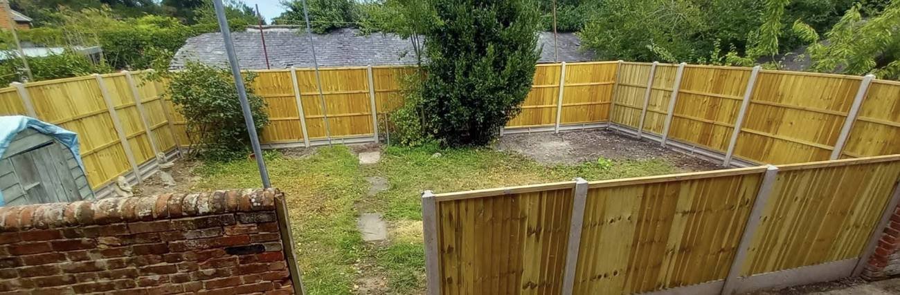 New closeboard fencing around a full gravel garden boundary, Kent