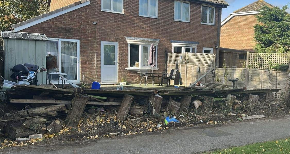 Broken collapsed fence panels and debris before replacement, Kent