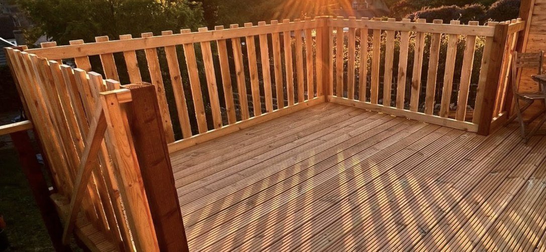 New timber deck with balustrade finished at sunset by Lawn Ranger Landscapes