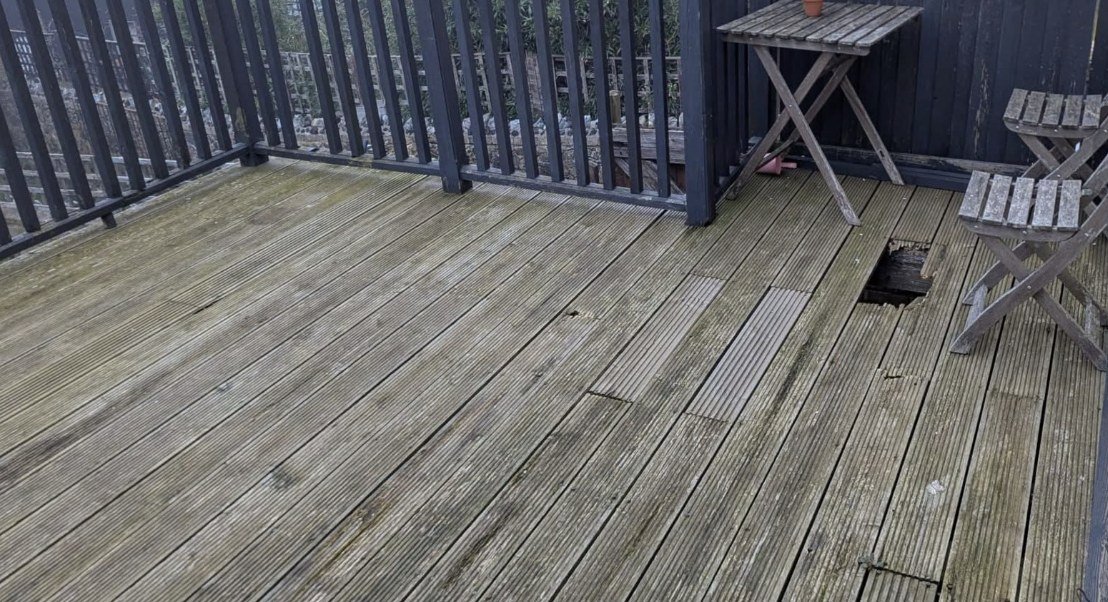 Old rotten and mossy decking boards before replacement in Kent
