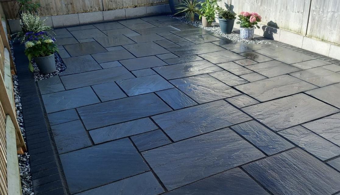 New slate patio and fresh turf by Lawn Ranger Landscapes, Kent